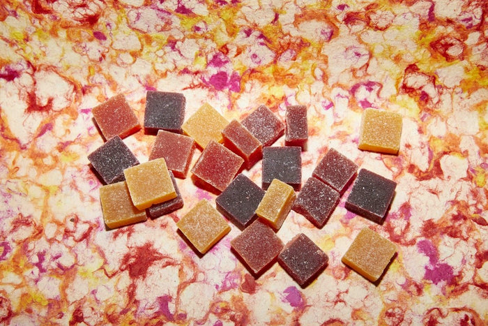 Colorful mushroom gummies and shroom gummies displayed on a table